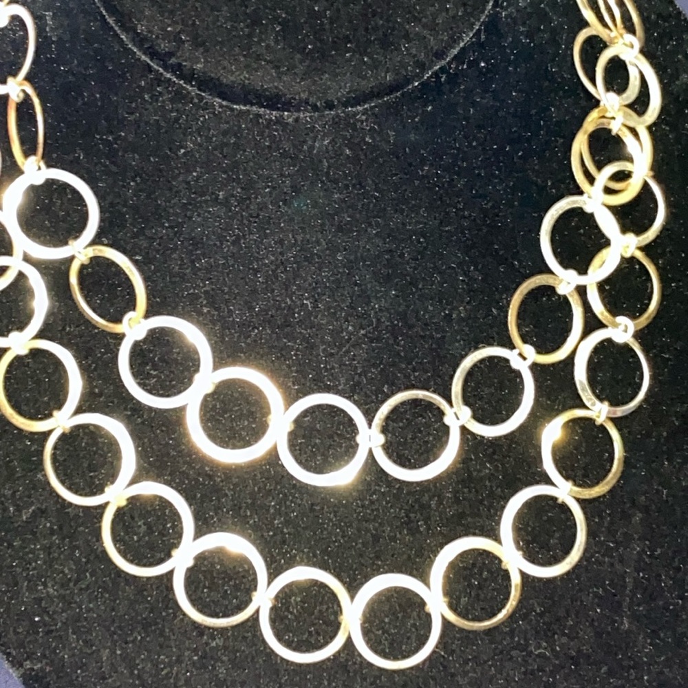 Woman’s fashion necklace with alternating gold-tone & Silver-tone metal circles